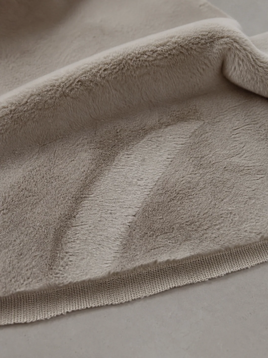 Faux Rabbit Fur fabric shown in a soft fold