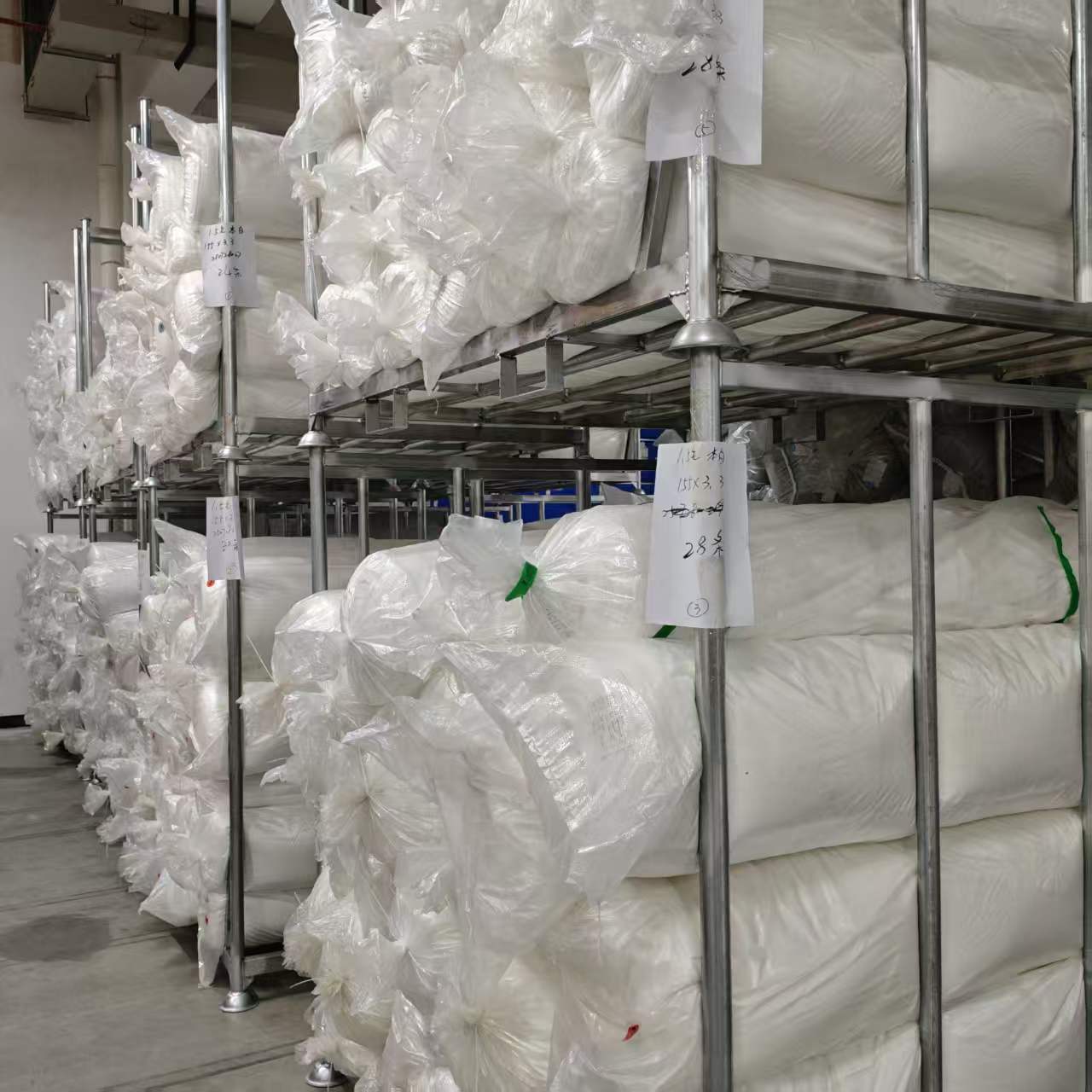 Wrapped fabric rolls held in the Dongguan warehouse